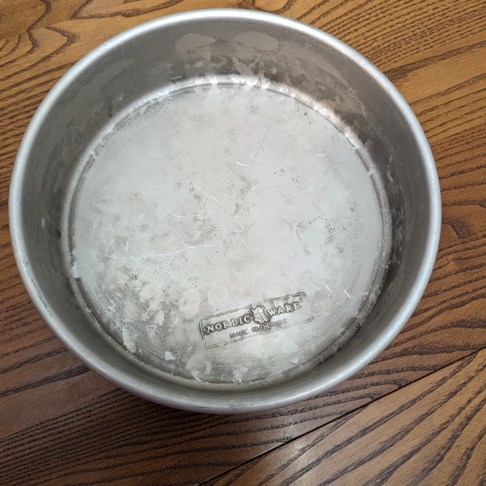 - Nordic Ware 9 inch circular cake pan. 3 inches high.  Aluminum. GUC..